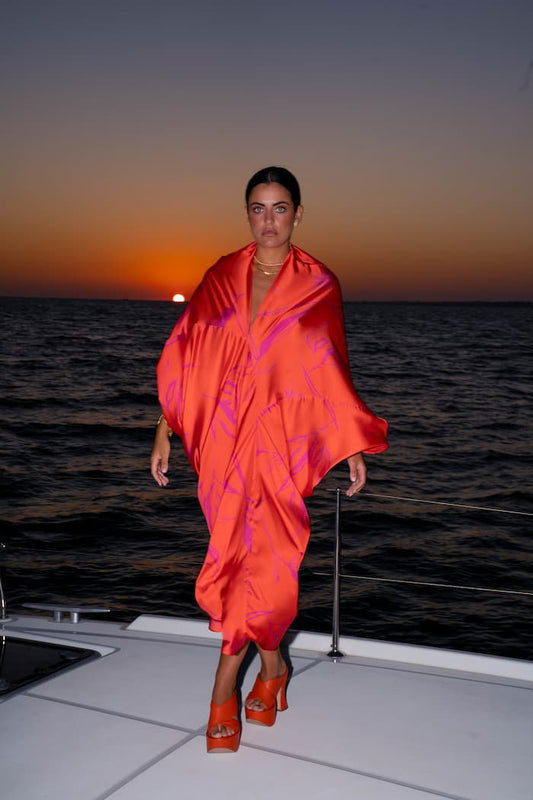 Vestido SHAIRA naranja con estampando en fucsia