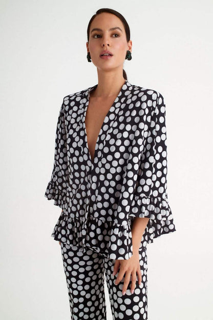 Pantalón de invitada negro con lunares blancos