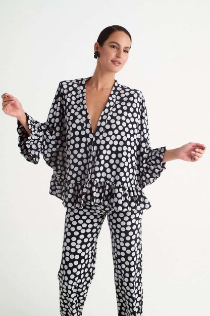 Pantalón de invitada negro con lunares blancos